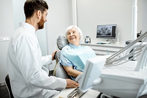 Patient smiling while speaking to dentist