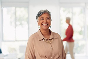 Smiling senior woman in business setting