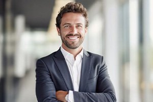 Handsome, smiling man wearing business attire