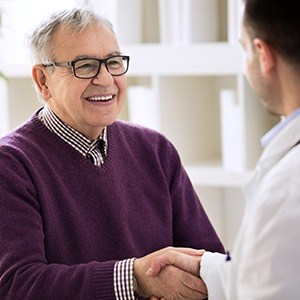 Man shaking hands with  his dentist