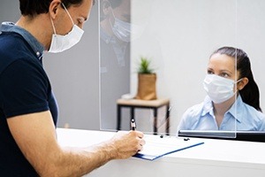 Dental team member reviewing patient's cosmetic dentistry plan
