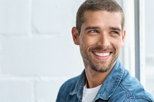 Smiling man enjoying the benefits of root canal treatment