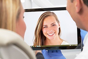 Dentist and patient looking at virtual smile design