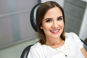 Woman smiling after dental crown procedure