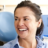 Woman smiling after treatment for toothaches