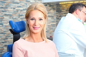 Woman smiling after tooth extraction