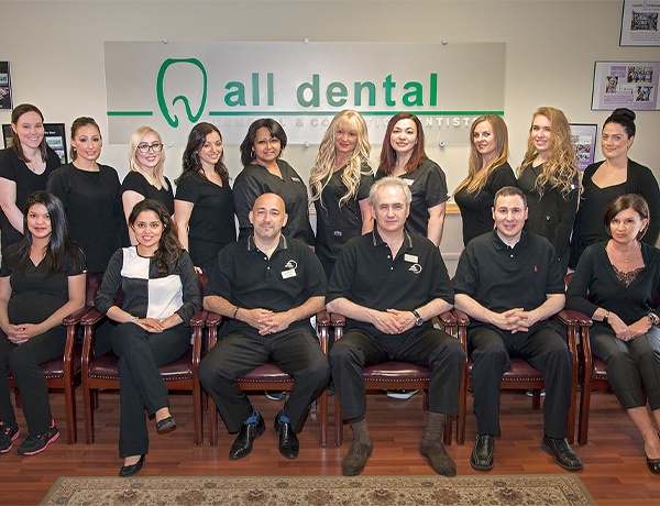 The All Dental team sitting in front area of Westborough dental office