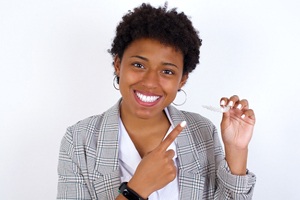 Young woman enjoying the benefits of Invisalign® treatment