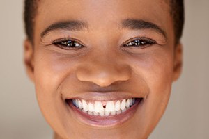 Portrait of smiling woman with gap between her front teeth