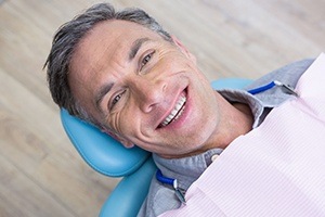 Man smiling during oral cancer screening