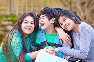 Sibling laughing together after dentistry for special needs children