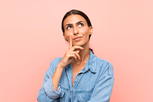 Portrait of thinking woman who has questions about root canal therapy