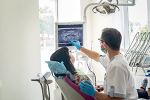 Dentist and patient engaged in conversation