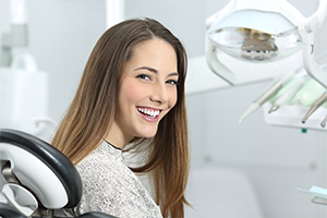 Woman smiling during sedation dentistry visit