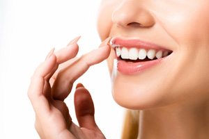 Close-up of woman’s beautiful smile with veneers