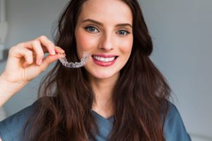 Woman enjoying successful Invisalign treatment in Westborough