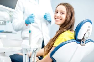 Young female dental patient looking over her shoulder