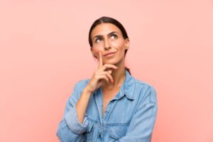 Woman wearing curious expression